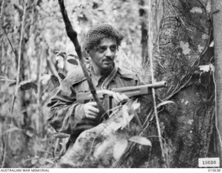 VX12436 Corporal George Swallow, 2/5 Battalion of Warragul on patrol at Mount Tambu