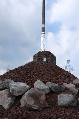 An electric utility ole is wrapped in thermal resistant material to protect it from 2014 Kilauea Volcano eruption and lava flow as it approaches the town of Pahoa, Hawaii.