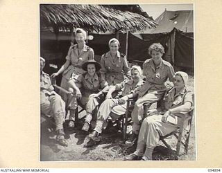 CAPE WOM, WEWAK AREA, NEW GUINEA. 1945-08-02. SEVEN OF THE NINE MEMBERS OF 104 CASUALTY CLEARING STATION THAT CONSTITUTE THE FEMALE POPULATION OF THE WEWAK AREA. IDENTIFIED PERSONNEL ARE:- SISTER ..