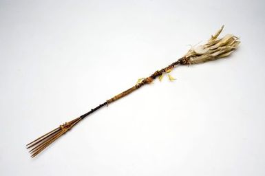 Decorated bamboo comb with a plume of feathers