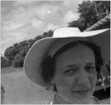 Woman outside of the Hind-Clarke Dairy Ice Cream Stand, Aina Haina Valley, Honolulu, Hawaii, 1930s