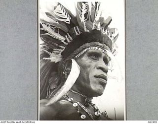 17 MILE, PORT MORESBY AREA, PAPUA, NEW GUINEA. 1943-12-25. "BILLY" CHIEF OF THE VILLAGES AND LEADER OF THE NATIVE DANCES HELD IN CONJUNCTION WITH THE 10TH AUSTRALIAN ADVANCED ORDNANCE DEPOT SPORTS ..