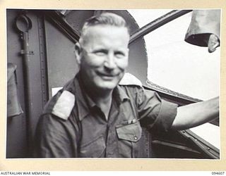 Nantambu, New Britain, 1945-07-26. Brigadier-General C.R.V. Edgar, Commander 4 Infantry Brigade, in the blister of a Catalina flying-boat