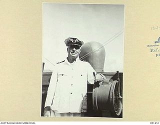 LAE, NEW GUINEA, 1945-05-07. CAPTAIN I.L. LLOYD, CAPTAIN OF THE MV DUNTROON WHO HAS COMMANDED THE VESSEL SINCE SHE WAS LAUNCHED TEN YEARS AGO. THE SHIP HAS BEEN WORKING AS A TROOPSHIP FOR THE PAST ..