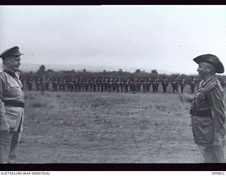 VUNAKANAU, NEW BRITAIN, 1946-02-12. FIRST FULL REGIMENTAL PARADE OF THE PACIFIC ISLANDS REGIMENT AS ONE COMPLETE UNIT. UNTIL THE WAR ENDED COMPANIES AND PLATOONS SERVED IN MANY DIFFERENT AREAS. ..