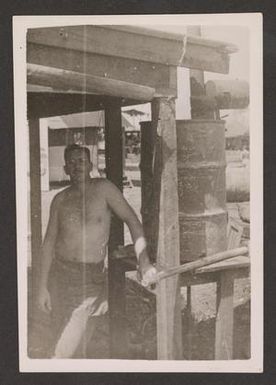 [Elmer Johnston Beside Hot Water Heater]