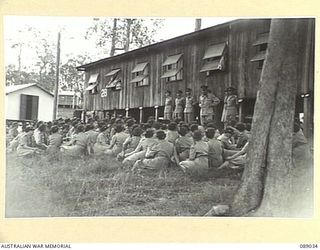 INDOOROOPILLY, QUEENSLAND. 1945-04-23. MAJOR GENERAL C.H. SIMPSON, (1), ADDRESSING PERSONNEL CONCENTRATED AT 2 AUSTRALIAN WOMEN'S ARMY SERVICE BARRACK BEFORE THEIR EMBARKATION TO NEW GUINEA