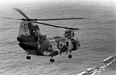 A Marine Medium Helicopter Squadron 261 (HMM-261) CH-46E Sea Knight helicopter lifts off from the amphibious assault ship USS SAIPAN (LHA 2) during a rehearsal for Operation Sharp Edge. The SAIPAN is on station off the coast of Liberia