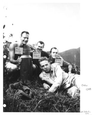 Military personnel lounging on grass