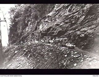 REINHOLD HIGHWAY, NEW GUINEA. 1943-08-25. JEEPS OF HEADQUARTERS, ROYAL AUSTRALIAN ENGINEERS, 11TH AUSTRALIAN DIVISION NEAR CLOWES CREEK ON THE NEW 68 MILE MILITARY HIGHWAY WHICH LINKS EDIE CREEK ..