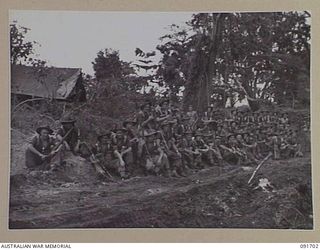 CAPE WOM, WEWAK AREA, NEW GUINEA. 1945-05-06. PERSONNEL OF MORTAR PLATOON, 2/11 INFANTRY BATTALION, TAKING A TEN MINUTE HALT DURING THEIR MOVEMENT TO NEW POSITIONS IN PREPARATIONS FOR THE ADVANCE ..