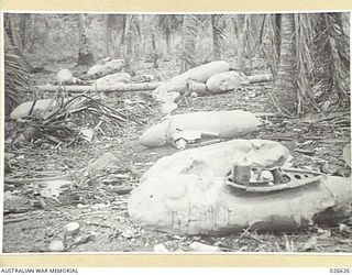 MILNE BAY, PAPUA. 1942-09. "BELLY" OR SPARE, PETROL TANKS OF JAPANESE ZERO FIGHTER PLANES LANDED BY THE JAPS IN THEIR ABORTIVE LANDING AT MILNE BAY