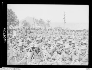RABAUL, NEW BRITAIN. 1945-10-10. A SPECIAL PARADE AND CONCERT WAS HELD AT THE CAMP TO CELEBRATE THE 34TH ANNIVERSARY OF THE FOUNDING OF THE CHINESE REPUBLIC. SHOWN, SECTION OF CONCERT AUDIENCE ..