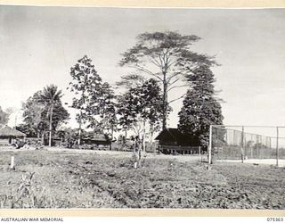 LAE, NEW GUINEA. 1944-02-18. THE QUARTERS OF THE GENERAL OFFICER COMMANDING AND TENNIS COURTS AT HEADQUARTERS, NEW GUINEA FORCE