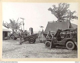 LAMARIEN, HENRY REID BAY, NEW BRITAIN, 1945-07-28. THE TRANSPORT SECTION OF 2/2 COMMANDO SQUADRON AT WORK IN THEIR JEEPS AND TRAILERS