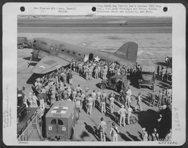 Men Gather Around A Douglas C-47 Which Has Just Landed At Hickam Field, Oahu, Hawaii. The Plane Evacuated Wounded From The Battle Of Midway, 7 June 1942. (U.S. Air Force Number 65342AC)