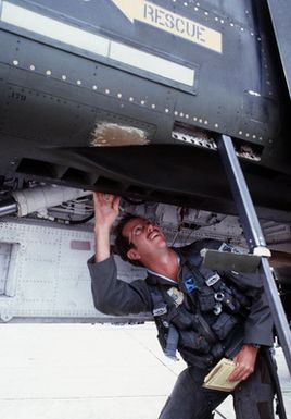 CPT Steve Sloop, 3rd Tactical Fighter Wing, makes a preflight inspection of his F-4 Phantom II aircraft during Exercise Opportune Journey 4
