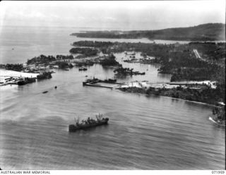 FINSCHHAFEN, NEW GUINEA. 1944-04-03. AN AERIAL VIEW OF THE HARBOUR SHOWING THE SHIPPING AND PORT INSTALLATIONS