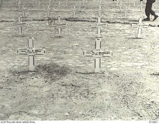 SALAMAUA, NEW GUINEA. 1944-04-30. A SECTION OF GRAVES AT SALAMAUA WAR CEMETERY. THE LETTERS MOHN ABOVE THE NAME AT THE EXTREME RIGHT FOREGROUND SIGNIFIES THE GRAVE OF A MEMBER OF THE MOHAMMEDAN ..