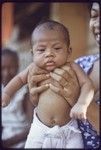 Young infant wearing cloth diaper