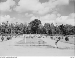 BUNA-GONA AREA, NEW GUINEA. 1945-10-14. THE SOPUTA WAR CEMETERY. ALTHOUGH NOW BECOMING AN ISOLATED SPOT BEHIND BUNA, IT IS KEPT IN PERFECT CONDITION BY THE AUSTRALIAN WAR GRAVES MAINTENANCE UNIT. A ..