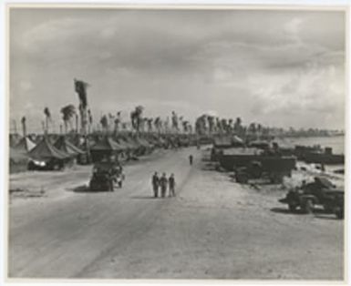 [Military vehicles and tents, Enewetak Atoll]