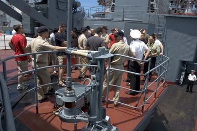 Russian Federation Navy (RFN) officers show American military around the Ship MARSHAL SHAPOSHNIKOV. The SHAPOSHNIKOV is one of four RFN ships and two US Navy (USN) ships participating off the coast of Guam (GU) in PASSEX 06, an exercise designed to increase interoperability between the two navies while enhancing the strong cooperative relationship between Russia and the United States