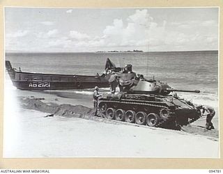 TOROKINA AREA, BOUGAINVILLE, 1945-08-06. AUSTRALIAN LANDING CRAFT 40 EXPERIENCING DIFFICULTIES IN PULLING OUT FROM THE BEACH. IT HAS TRANSPORTED TWO M24 GENERAL CHAFFEE LIGHT TANKS TO THE AREA FOR ..