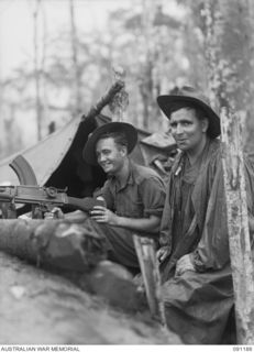 NUMA NUMA TRAIL, BOUGAINVILLE. 1945-04-24. MEMBERS OF THE 27 INFANTRY BATTALION MANNING A BREN GUN PIT. THIS WAS PART OF THE FIRST ACTION FOR THE BATTALION ON COMPLETION OF ITS TRAINING ON GREEN ..