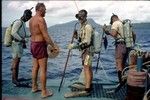 George Hohnhaus (in red shorts) on ship with scuba divers near Truk, Micronesia, during the Carmarsel Expedition