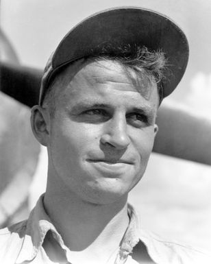 World War II (WWII) area photograph of US Marine Corps (USMC) First Lieutenant (1LT) Edward O. Shaw, taken at Guadalcanal, 1943. 1LT Shaw is an ace pilot and is credited with 13 kills