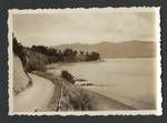 View of road beside lake, mountains in background, New Zealand?