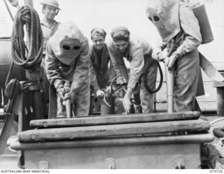 AT SEA. 1944-08/09. THE FIRE CONTROL PARTY AT "ACTION STATIONS" ABOARD THE RAN CORVETTE GEELONG AS THE VESSEL PROCEEDS ON HER PATROL ALONG THE COAST OF NEW GUINEA