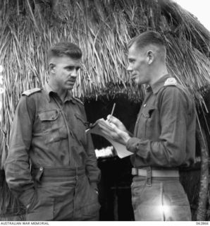 DUMPU, NEW GUINEA. 1944-01-11. NX17 MAJOR B. H. TRAVERS, BRIGADE MAJOR (1) AND QX6578 CAPTAIN E. T. LENTON, ACTING STAFF CAPTAIN (2) BOTH OF THE 15TH INFANTRY BRIGADE