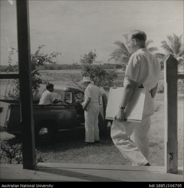 Field Officers and farmer in the back of a ute