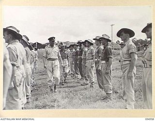LAE AREA, NEW GUINEA. 1945-08-13. COLONEL I.J. WOOD, COMMANDING OFFICER, 2/7 GENERAL HOSPITAL, INSPECTING B COMPANY OF THE HOSPITAL STAFF