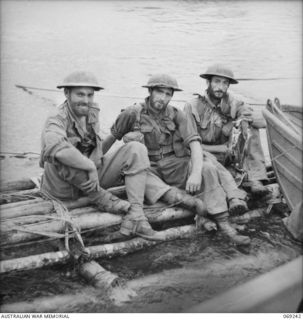 KALIKODOBU, NEW GUINEA. 1942-10. N157031 LIEUTENANT C.G.D. BUTLER (LEFT) AND TWO OTHER MEMBERS OF THE PARTY OF THE 2/14TH INFANTRY BATTALION WHICH WERE CUT OFF FROM THE MAIN BODY OF TROOPS NEAR ..