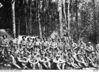 Group portrait of 11 Platoon, B Company, 2/14th Infantry Battalion on the Kokoda Trail. Known to be in photograph are: Corporal (Cpl) T Hayes; Lieutenant (Lt)  Moore; Lt Dewar; Private (Pte) Crump; ..