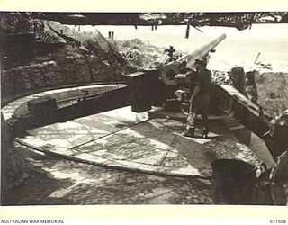 PORT MORESBY, PAPUA, NEW GUINEA. 1944-03-27. A 155MM M1917 BATTERY, COAST ARTILLERY ON A MOVABLE LOADING PLATFORM