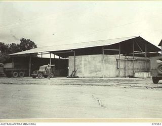 LAE, NEW GUINEA. 1944-03-23. THE ICE WORKS WITHIN THE HEADQUARTERS, LAE BASE SUB-AREA NOW RE-BUILT AND IN OPERATION FOLLOWING BOMB DAMAGE RECEIVED FROM THE ROYAL AUSTRALIAN AIR FORCE DURING ..