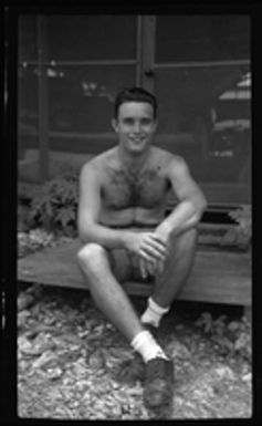 [Elmer A. Ball sitting outside building]