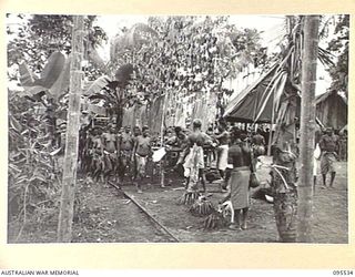 WUNUNG, JACQUINOT BAY, NEW BRITAIN, 1945-08-25. NATIVE WOMEN LINING UP FOR FOOD AFTER THE SING-SING HELD AT THE ALLIED INTELLIGENCE BUREAU TO MARK THE END OF HOSTILITIES