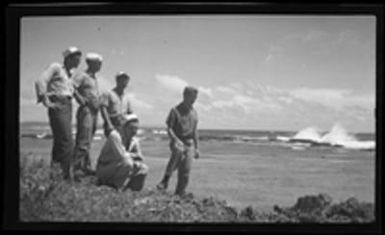 [Servicemen on beach]