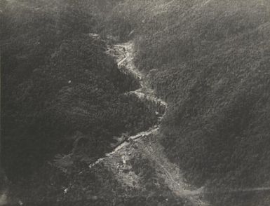 Aerial view of Bulolo Gold Dregding coy's hydro-electric scheme and one of first roads cleared in the New Guinea goldfields