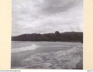 SATTELBERG, NEW GUINEA. 1944-07-06. THE COASTLINE NEAR THE SATTELBERG AREA. THE PHOTOGRAPH WAS TAKEN FOR USE BY VX76415 LIEUTENANT R.B. EWERS, OFFICIAL WAR ARTIST, MILITARY HISTORY SECTION