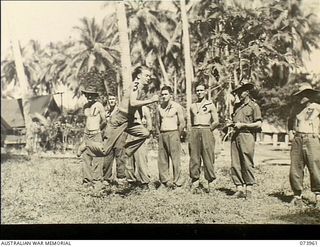 Madang, New Guinea. 1944-06-17. Troops participating in the hop step and jump at a Tabloid sports meeting conducted by Headquarters 15TH Infantry Brigade within the Siar Plantation. VX135530 ..