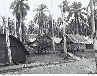 LUNGGA, GUADALCANAL, SOLOMON ISLANDS, 1944-02-29. A VIEW OF THE HEADQUARTERS CAMP OF THE DEPUTY SUPERVISING INTELLIGENCE OFFICER (DSIO), NAVAL INTELLIGENCE DIVISION, RAN. AT LEFT IS THE FRONT OF ..