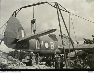 VIVIGANI, GOODENOUGH ISLAND, PAPUA. 1943-12-26. A BEAUFIGHTER BOMBER AIRCRAFT, CODED LY-B, RAAF SERIAL NO. A19-134, OF NO. 30 (BEAUFIGHTER) SQUADRON RAAF, BEING OVERHAULED BY A SERVICING PARTY. ..