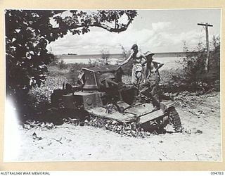 A burnt out Stuart M3A1 light tank on the beach at Empress Augusta Bay in Bougainville