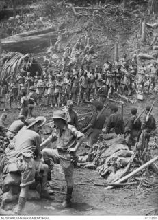 OWEN STANLEY RANGES, NEW GUINEA. 1942-08-28. SCENES IN A NATIVE VILLAGE AT EORA CREEK, IN THE JUNGLE COUNTRY THAT IS THE BATTLEGROUND FOR AUSTRALIAN AND JAPANESE TROOPS IN THEIR STRUGGLE FOR ..